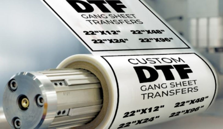 roll of transparent film that says "custom DTF gang sheet transfers"